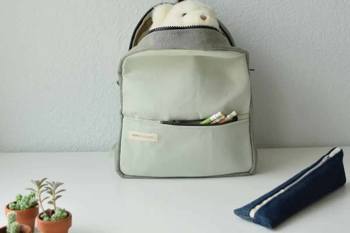 A child's backpack packed and waiting on a table
